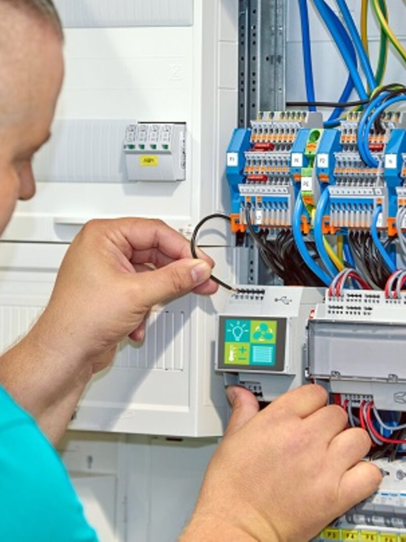 Systems integration technician configuring infrastructure equipment